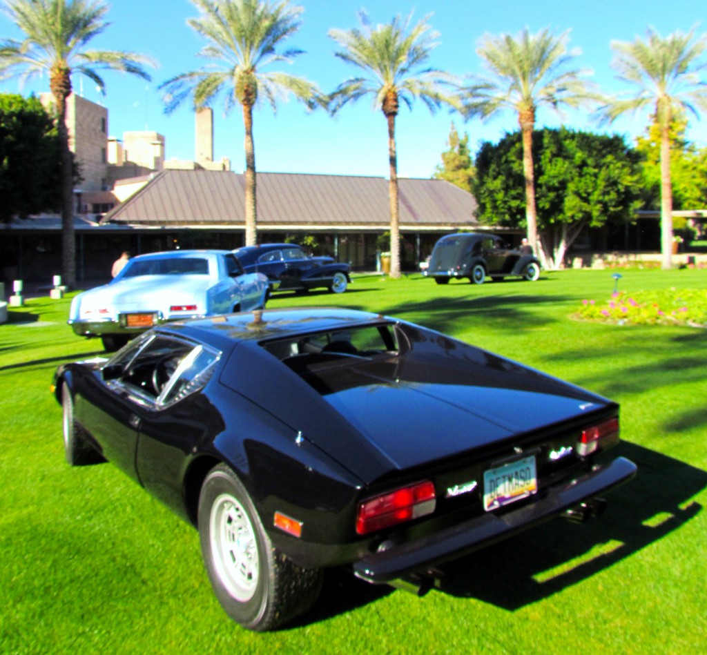 An exotic DeTomaso Pantera follows a 1963 Buick Riviera, a 1947 Cadillac and a 1937 Lincoln across the lawn at the Arizona Biltmore Resort in Phoenix. (Photo: Larry Edsall) 