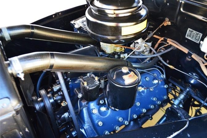 The flathead V8 engine runs smoothly, the seller says