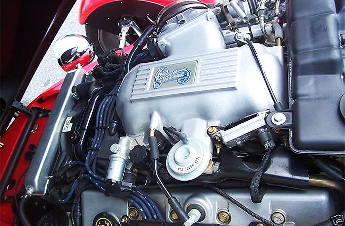 Strong power is provided by a Ford DOHC Cobra V8 
