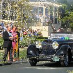 A shower of confetti greets the Isotta Fraschini