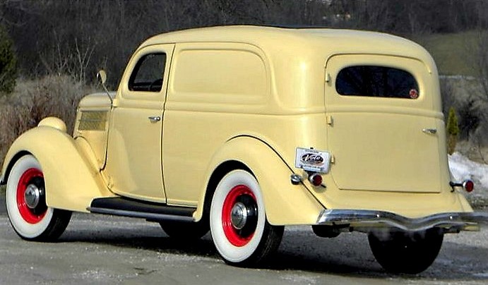 The red wheels set off the cream-colored paint job