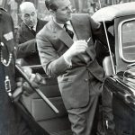 Prince Philip and 1954 Lagonda 3 Litre Drophead Coupe (Duke of Edinburgh boarding the car with his chauffeur Walter Bennett in the background)