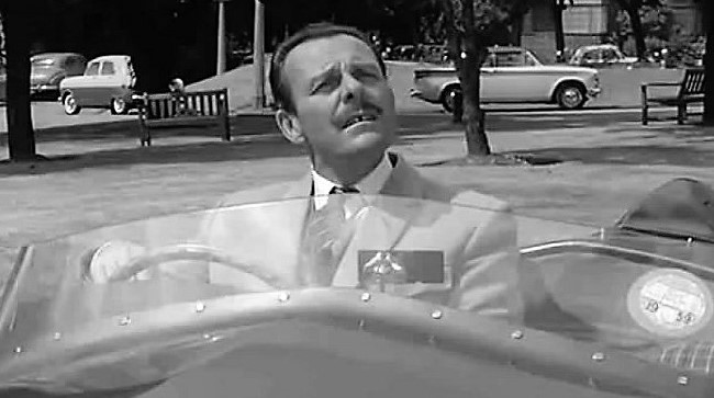 Comedian Terry-Thomas at the wheel of the 'Bellini' in the 1960 film 'School for Scoundrels' | Guardsman FIlms 