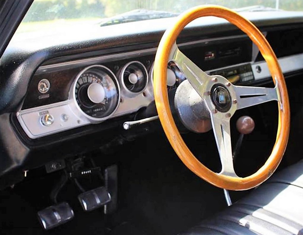The all-original Dart boasts a four-speed, wood steering wheel and rally gauges 