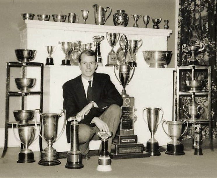 John Fitch with his racing trophies | International Motor Racing Research Center 