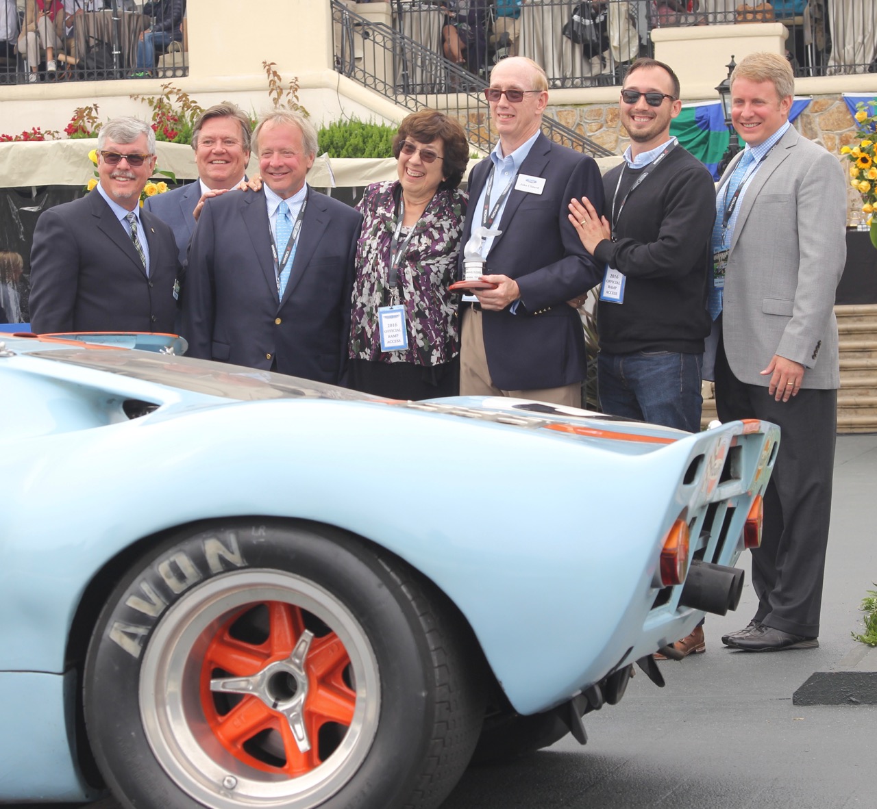 Ford officials and his wife join Clinard and a GT40 at Pebble Beach ceremony