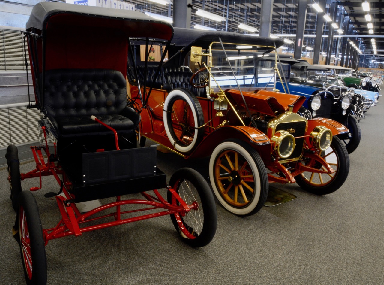 The ancient Locomobile is the only car here with a tiller, and heads the brass-era part of the collection