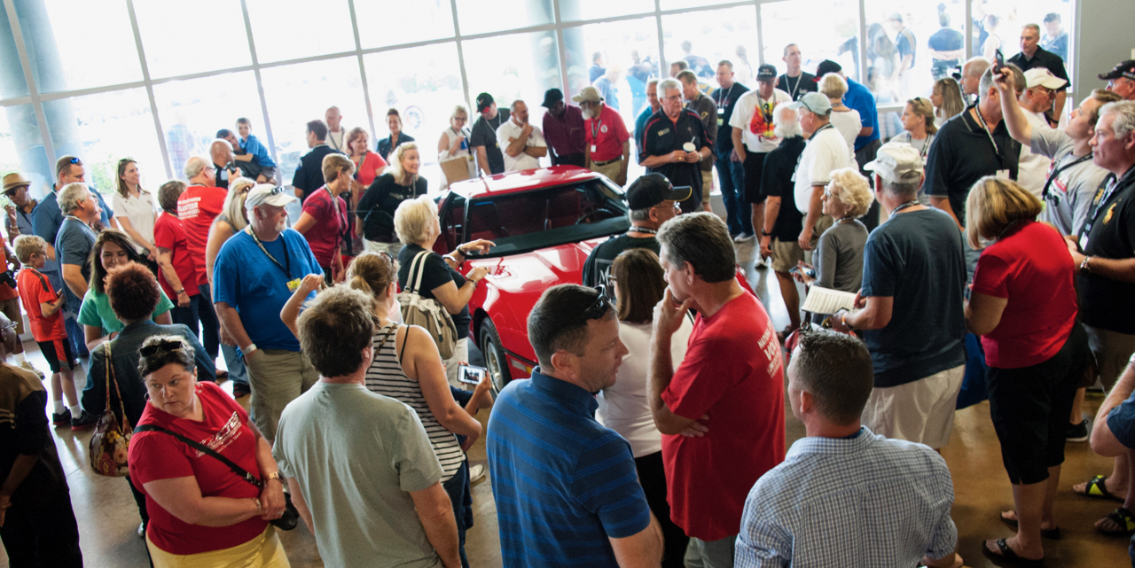 Staff and friends gather for the completed car's return