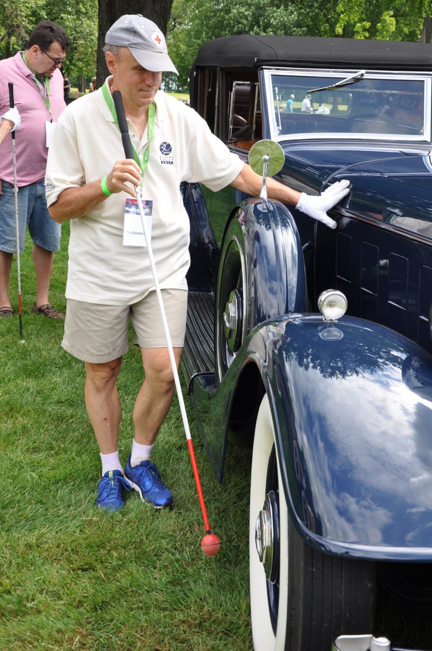 Some judges are hands-on at this car show