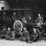 Chauffeurs and staff around c.1911 Daimler – Copy