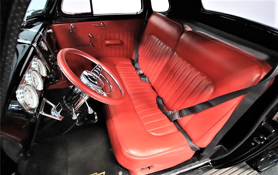 The Chevy's red interior has been updated for comfort 
