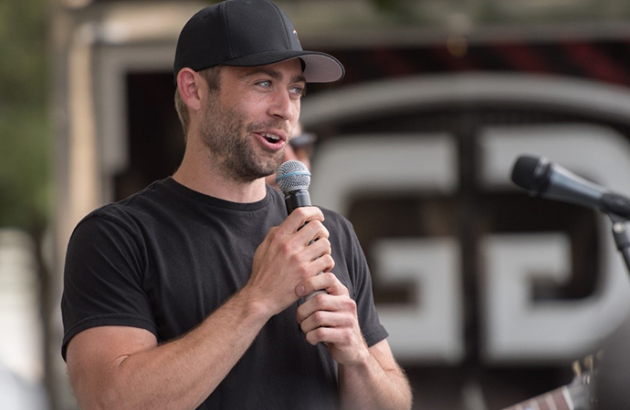 Cody Walker, the brother of the late Paul Walker, addresses the crowd at the In Memory of Paul car show. | Jose Pineda Photo