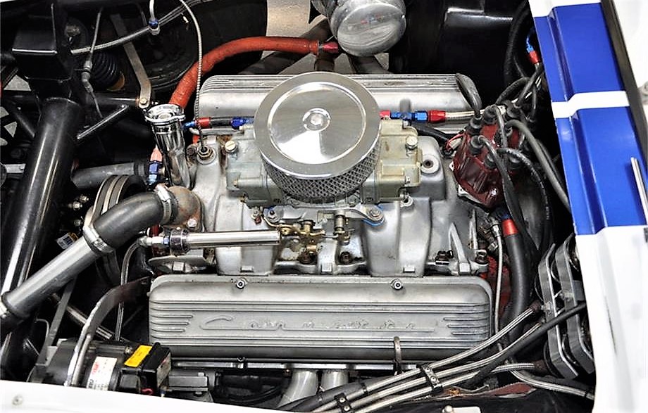 A 327/425-horsepower Corvette engine lies under the hood