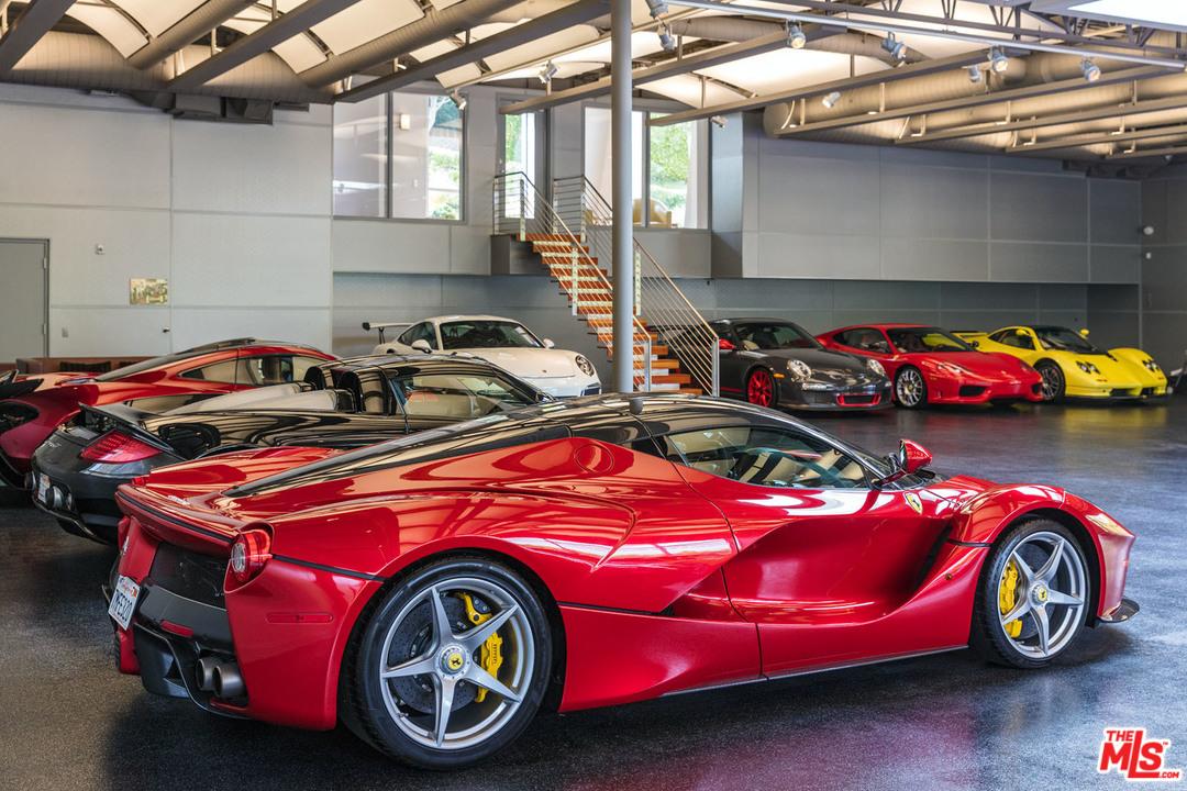 Talk about home sweet home: A California home that sold for more than $7.3 million easily double as an automotive museum thanks to a garage that fits at least 25 cars. | Estately photo