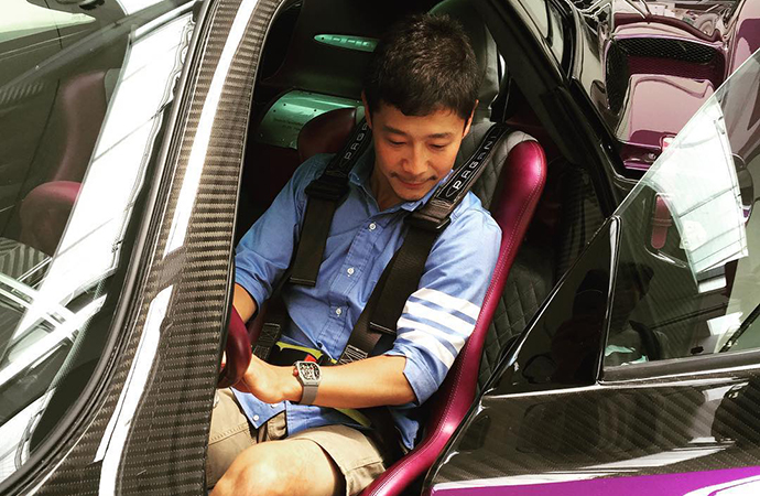 Japanese billionaire Yusaku Maezawa, who will be the first tourist to fly around the moon with SpaceX, is an avid car collector. He is shown sitting in this photo sitting in his Pagani. | Instagram photo/@yusaku2020