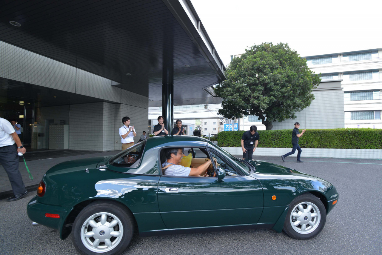 Keiji and Norimi Nishimoto drive away in their 1992 Eunos Roadster. It cost more than a new car to complete the work, but Keiji said it was worth it. | Mazda photo