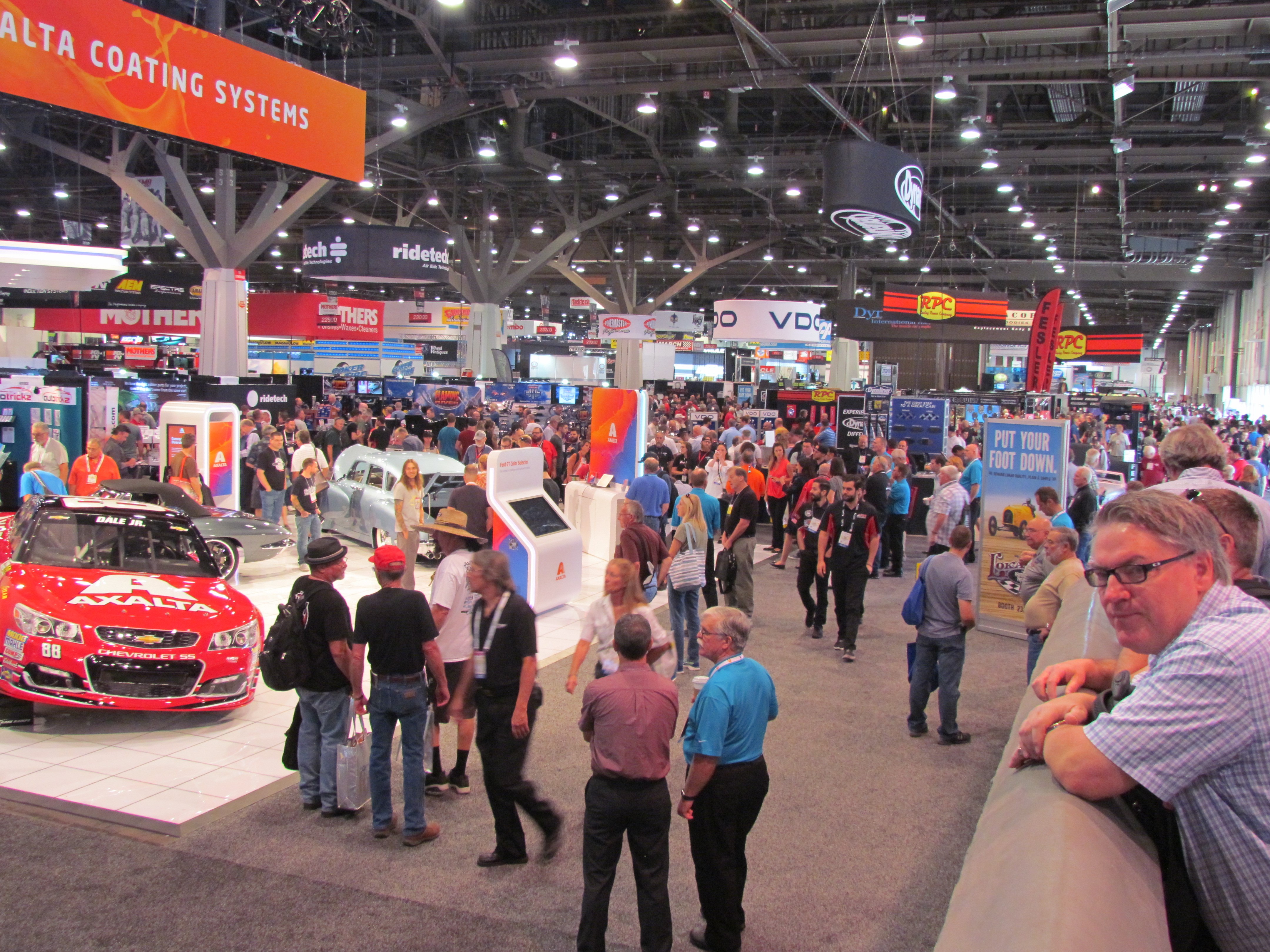 The floor of the annual SEMA Show is littered with booths and demonstrations of new aftermarket automotive parts. | SEMA photo