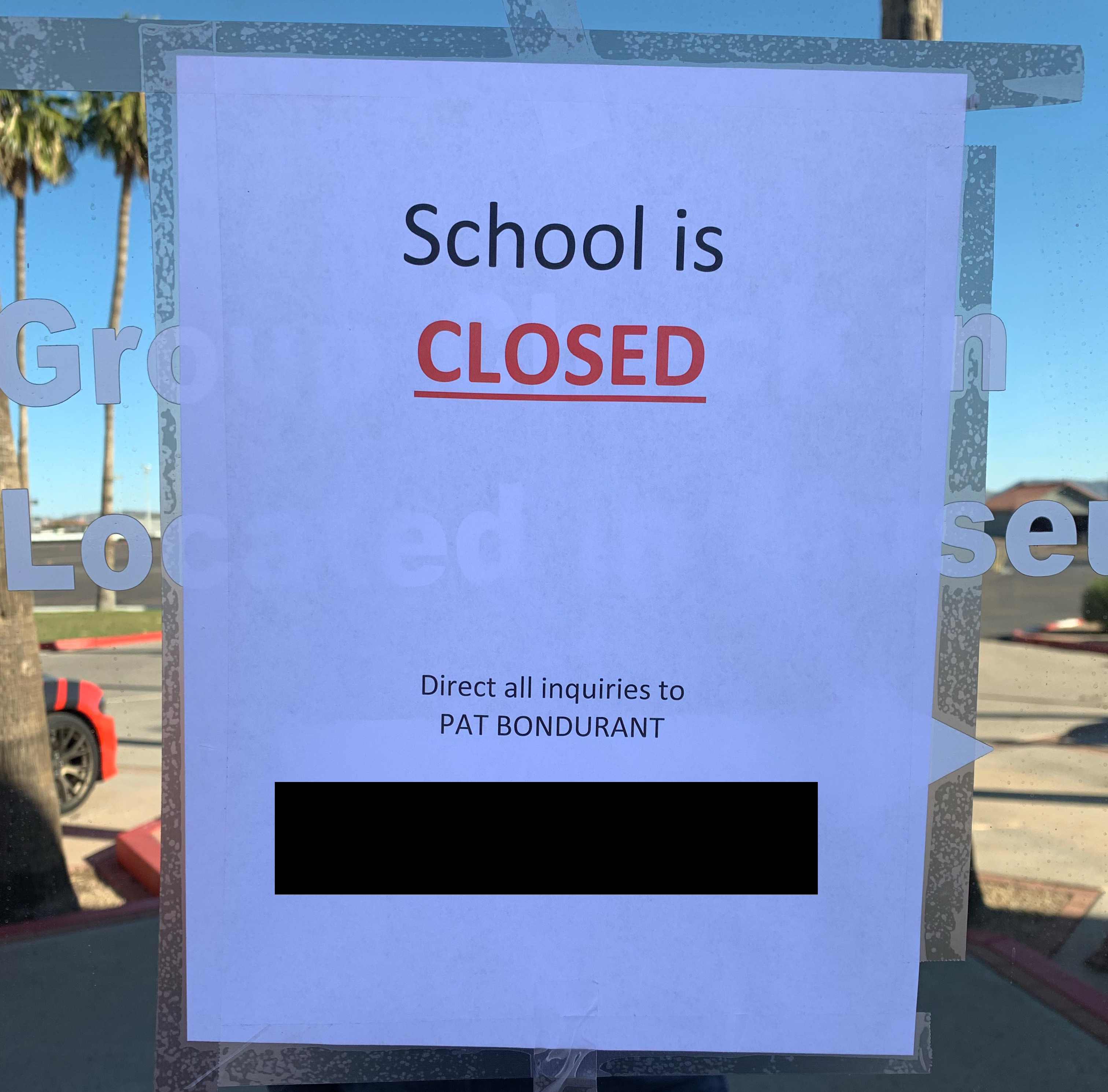 This sign was taped to the doors at the Bob Bondurant School of High Performance Driving on November 12. We blocked out the phone number on the sign, which was Pat Bondurant's personal cell phone. | Carter Nacke photo